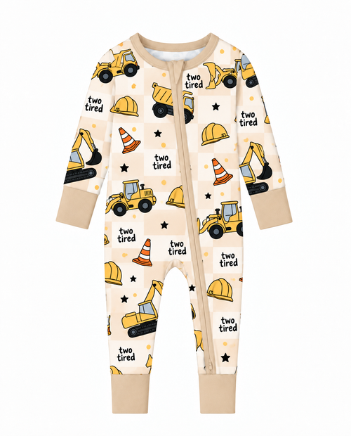Two Tired Construction long sleeve bamboo zippy with yellow dump trucks and excavators on a cream checkerboard prin