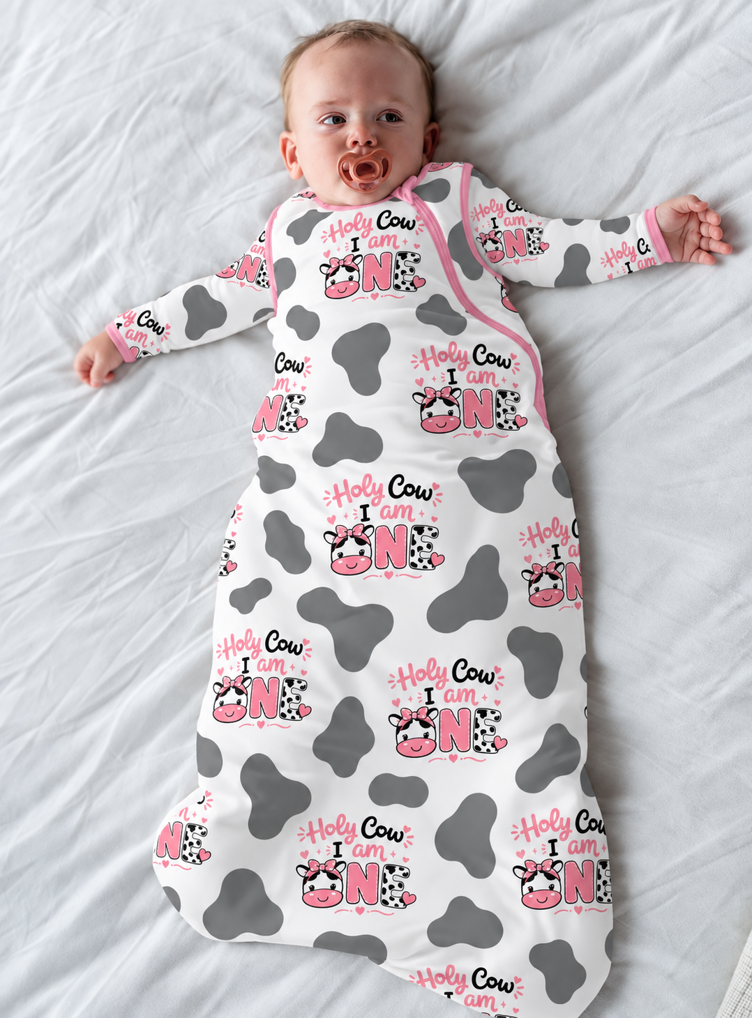 Baby in a Holy Cow I'm One cow print bamboo sleep sack with a two-way zipper