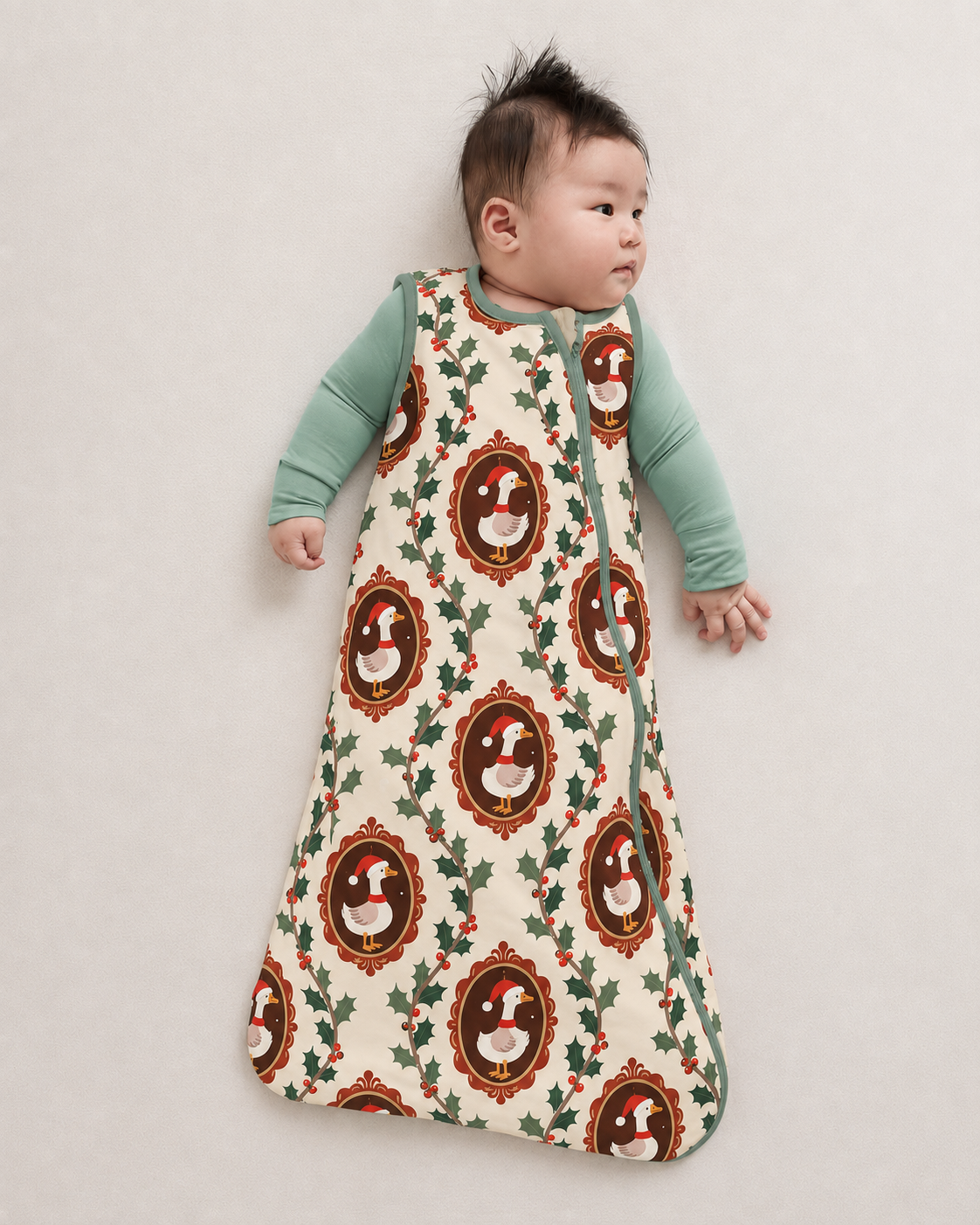 Baby wearing a cream Vintage Christmas Goose bamboo sleep sack with geese and holly wreaths