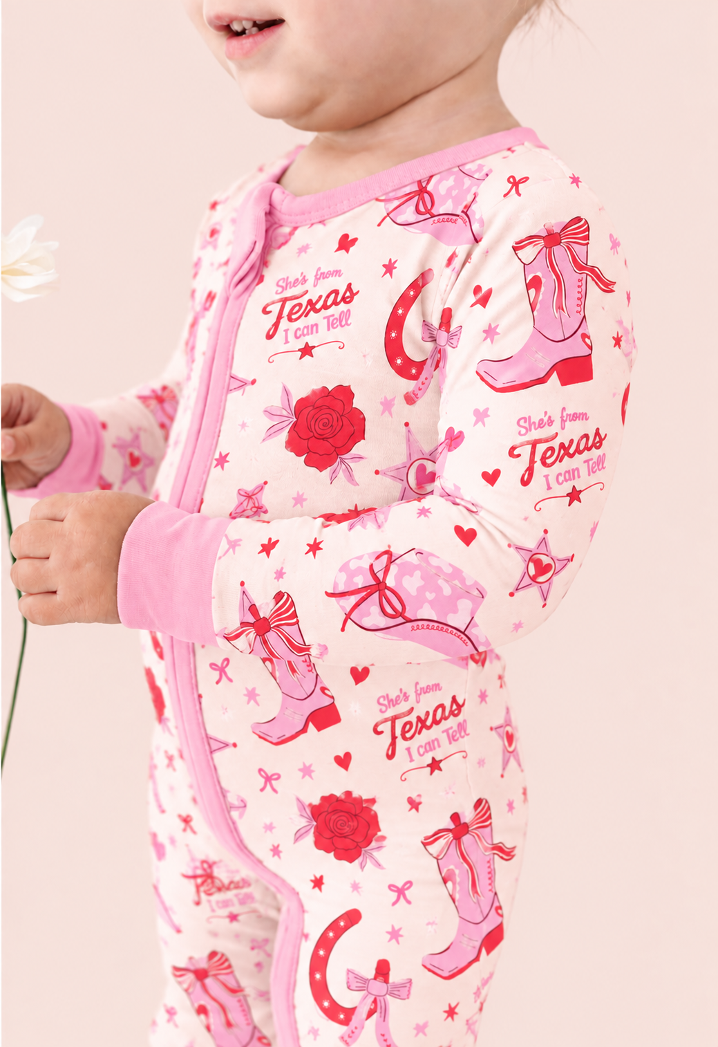 Little Texan long sleeve bamboo zippy romper with cowgirl boots and lone star western print
