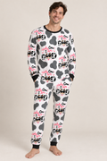 Man wearing Holy Cow I'm Dad men's bamboo pajamas, white with grey cow spots, pink and black Holy Cow I Am Dad lettering and black cuffs