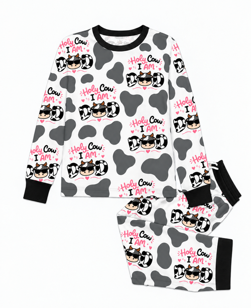 Flat lay of the Holy Cow I'm Dad men's bamboo pajama set, a crew neck top and joggers in grey cow print with black trim