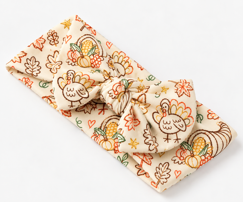 Gobble Wobble bamboo bow headband with a big top-knot bow, doodled turkeys, cornucopias and fall leaves on cream