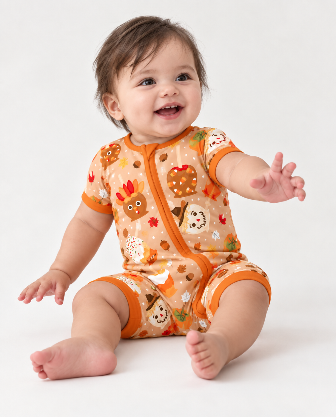 Gobble Apples bamboo pajamas with turkey and scarecrow caramel apples on a camel background and burnt orange trim