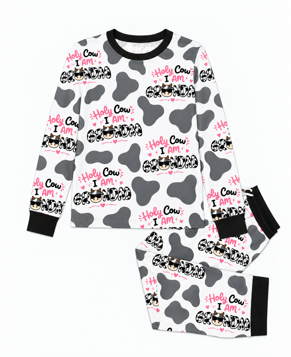 Flat lay of the Holy Cow I'm Grandad men's bamboo pajama set, a crew neck top and joggers in grey cow print with black trim