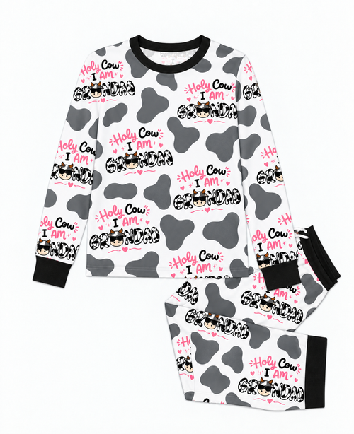 Flat lay of the Holy Cow I'm Grandad men's bamboo pajama set, a crew neck top and joggers in grey cow print with black trim